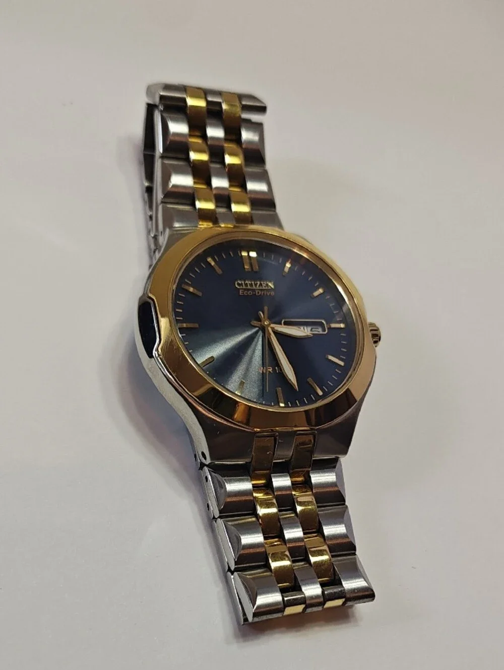Citizen Eco-Drive Two-Tone Watch with Black Dial and Gold Accents
